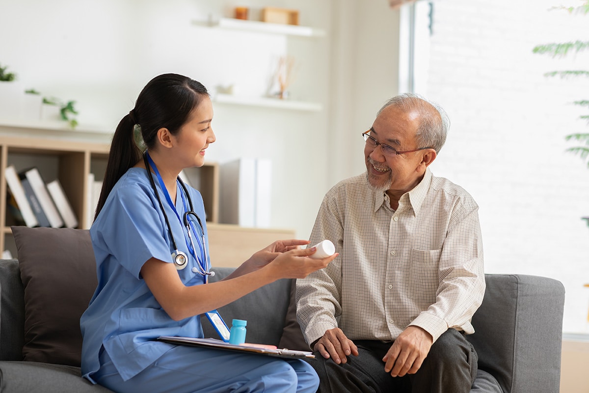 Older adult getting prescription advice from a physician
