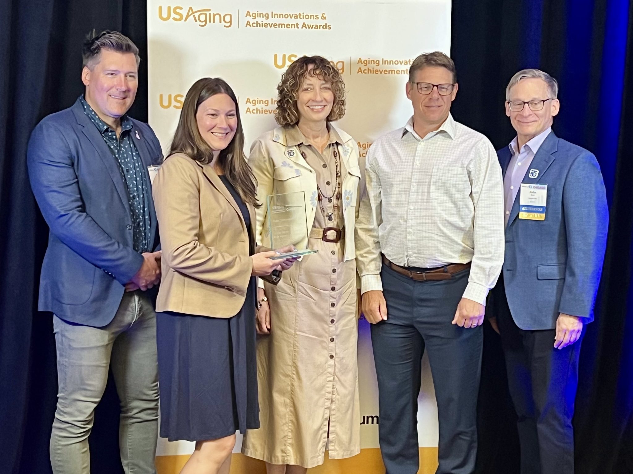 The Senior Alliance team receives the USAging Aging Innovation Award for the Halal Congregate Meals Program at the USAging Conference 2025 in Chicago.